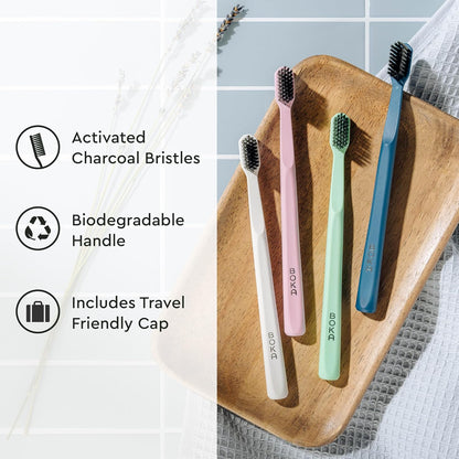 Boka_Classic_Manual_Toothbrush_with_Extra_Soft_Activated-Charcoal,_Tapered_Bristles,_Bioplastic_Handle_that_Includes_Travel_Cap,_Dentist-Approved,_Great_for_Adults_and_Kids,_Multi_Color_(Pack_of_4)