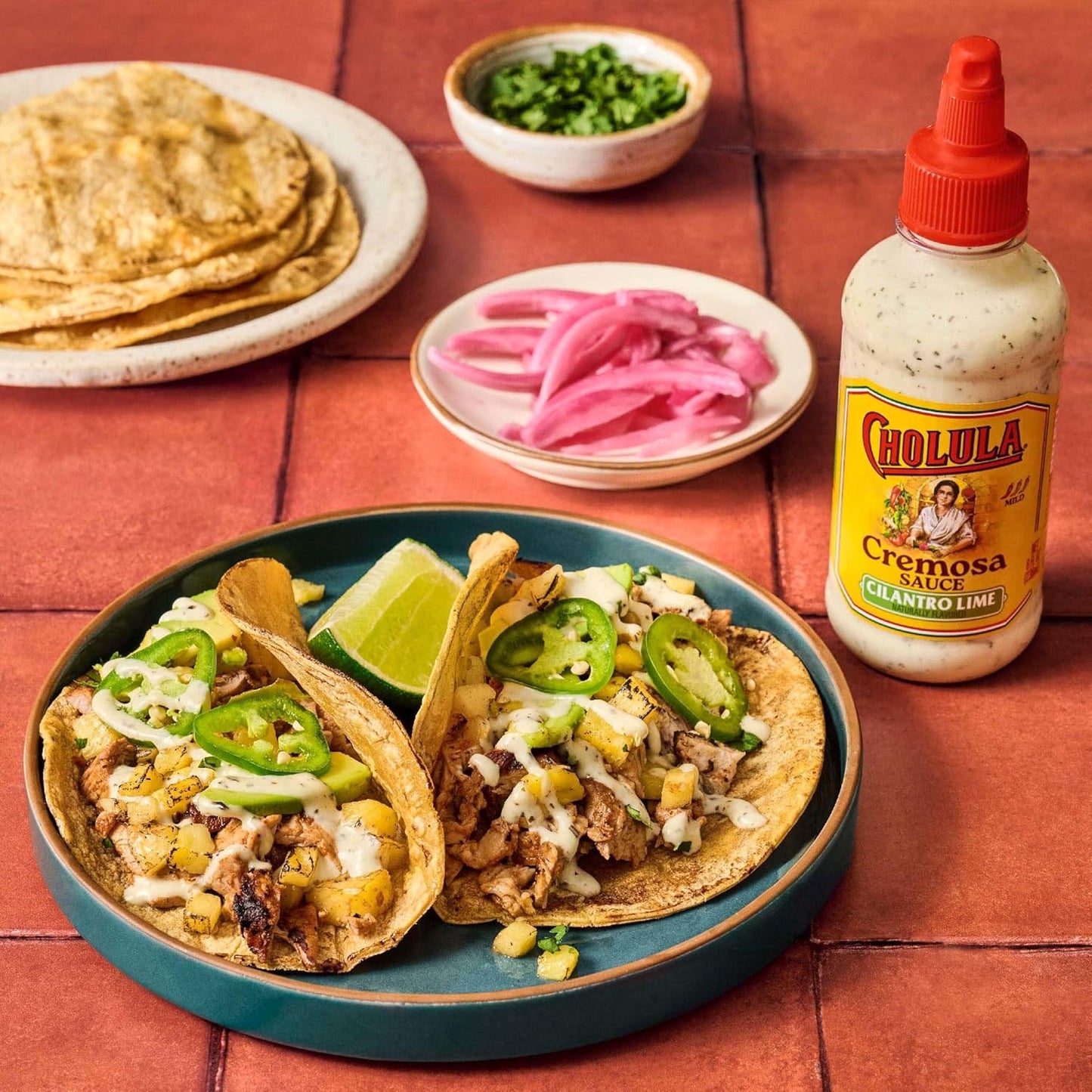Cholula_Cremosa_Sauce,_Cilantro_Lime,_Mild_Heat,_Creamy_Squeezable_Topping_for_Tacos,_Enchiladas,_Soup,_Tostadas,_Eggs_and_More,_8_fl_oz