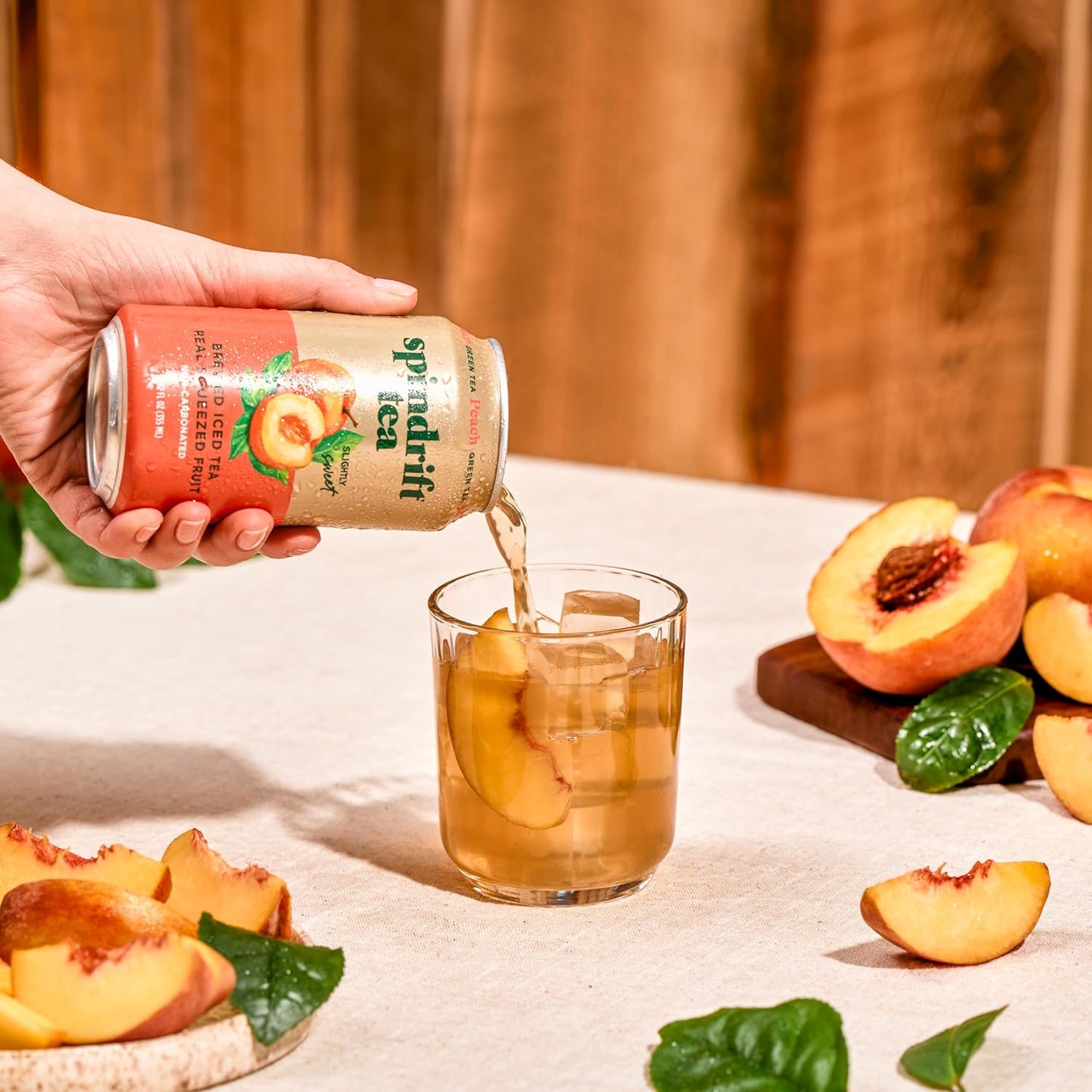 Spindrift_Brewed_Iced_Tea,_Peach_Green_Tea,_Made_with_Real_Squeezed_Fruit,_No_Carbonation,_Slightly_Sweet,_12_Fl_Oz_Cans,_Pack_of_12_(Only_49_Calories_per_Can)