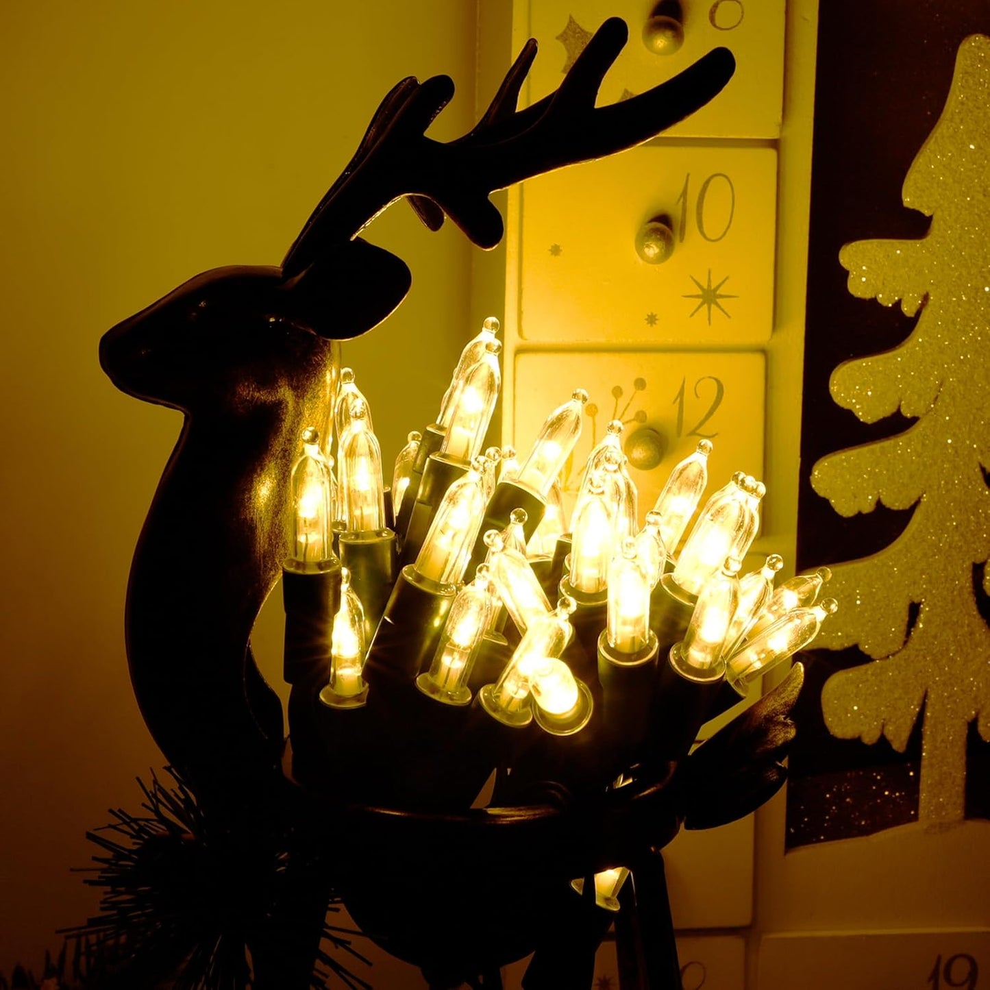 Blissun_Christmas_Lights,_50-Count_Green_Wire_Light_Set,_Battery_Operated_Christmas_Mini_String_Light_with_8_Modes,_16_ft_Fairy_Lights_for_Christmas_Tree_Garden_Wreath_Decorations_(2_Pack,_Warm_White)