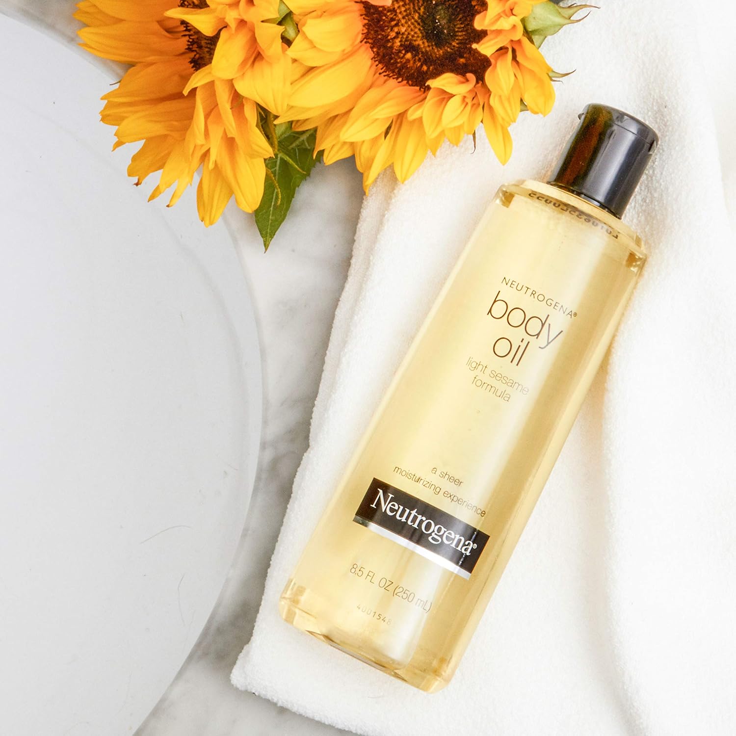 Neutrogena_Body_Oil_Light_Sesame_Formula,_16_fl_oz,_Radiant_Glow_Moisturizer_for_Dry_Skin,_Bath_&_Shower_Oil_For_Smooth_and_Hydrated_Skin