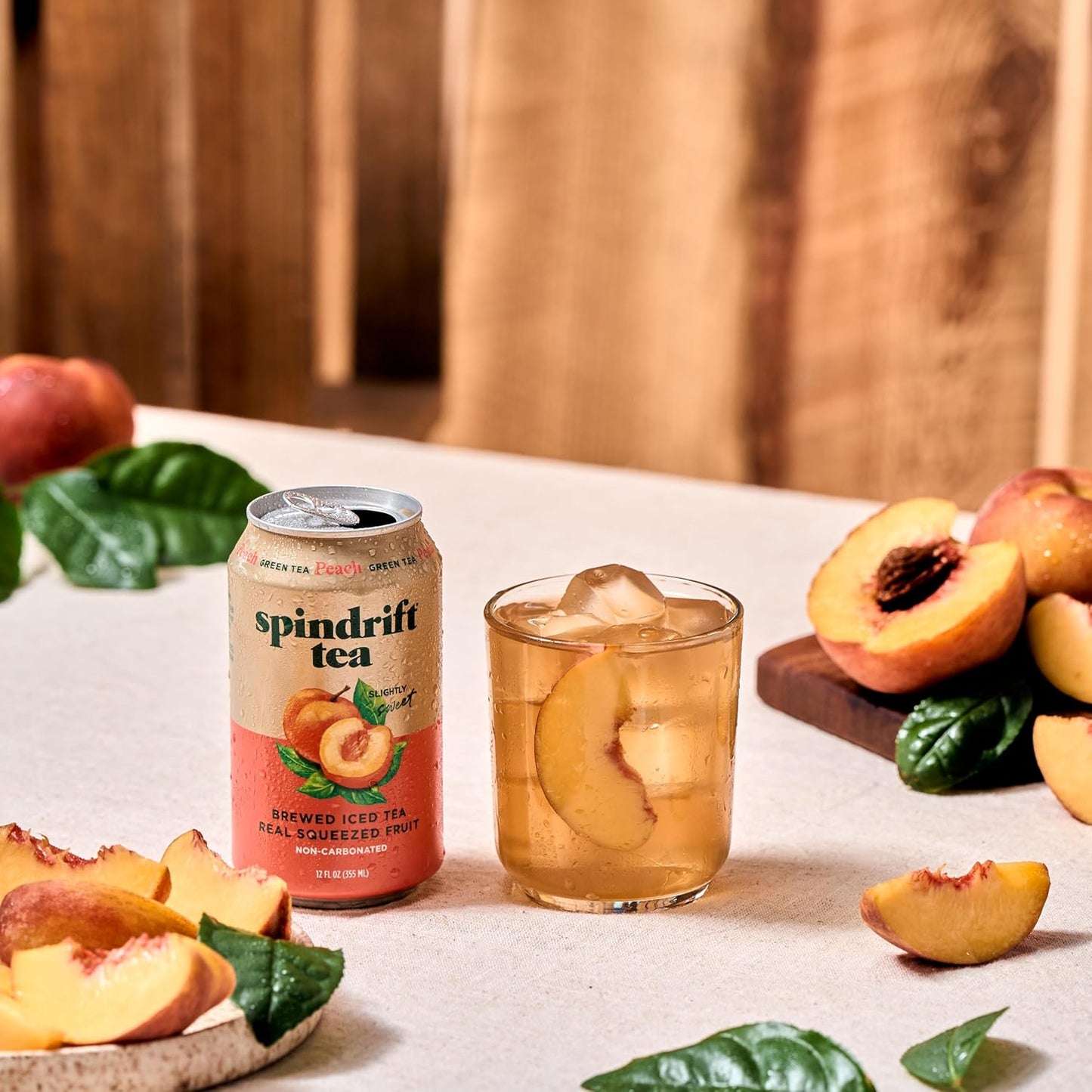Spindrift_Brewed_Iced_Tea,_Peach_Green_Tea,_Made_with_Real_Squeezed_Fruit,_No_Carbonation,_Slightly_Sweet,_12_Fl_Oz_Cans,_Pack_of_12_(Only_49_Calories_per_Can)