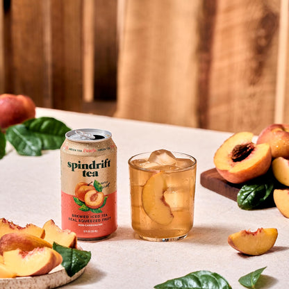 Spindrift_Brewed_Iced_Tea,_Peach_Green_Tea,_Made_with_Real_Squeezed_Fruit,_No_Carbonation,_Slightly_Sweet,_12_Fl_Oz_Cans,_Pack_of_12_(Only_49_Calories_per_Can)