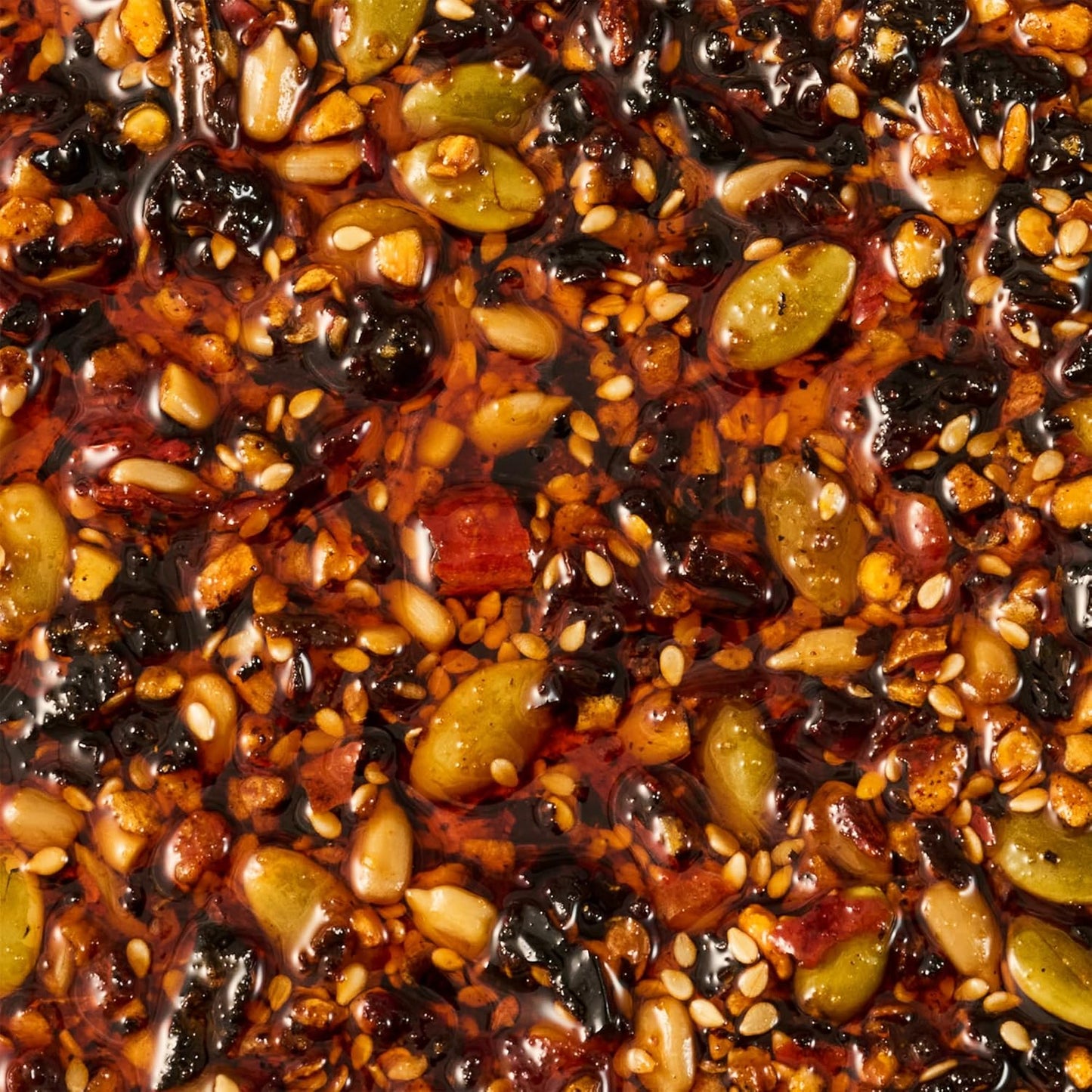 Cholula_Chili_Crisp_Sauce,_Chiles_&_Pepitas,_Crunchy_Topping_for_Tacos,_Tostadas,_Eggs,_Pizza_and_More,_8_oz